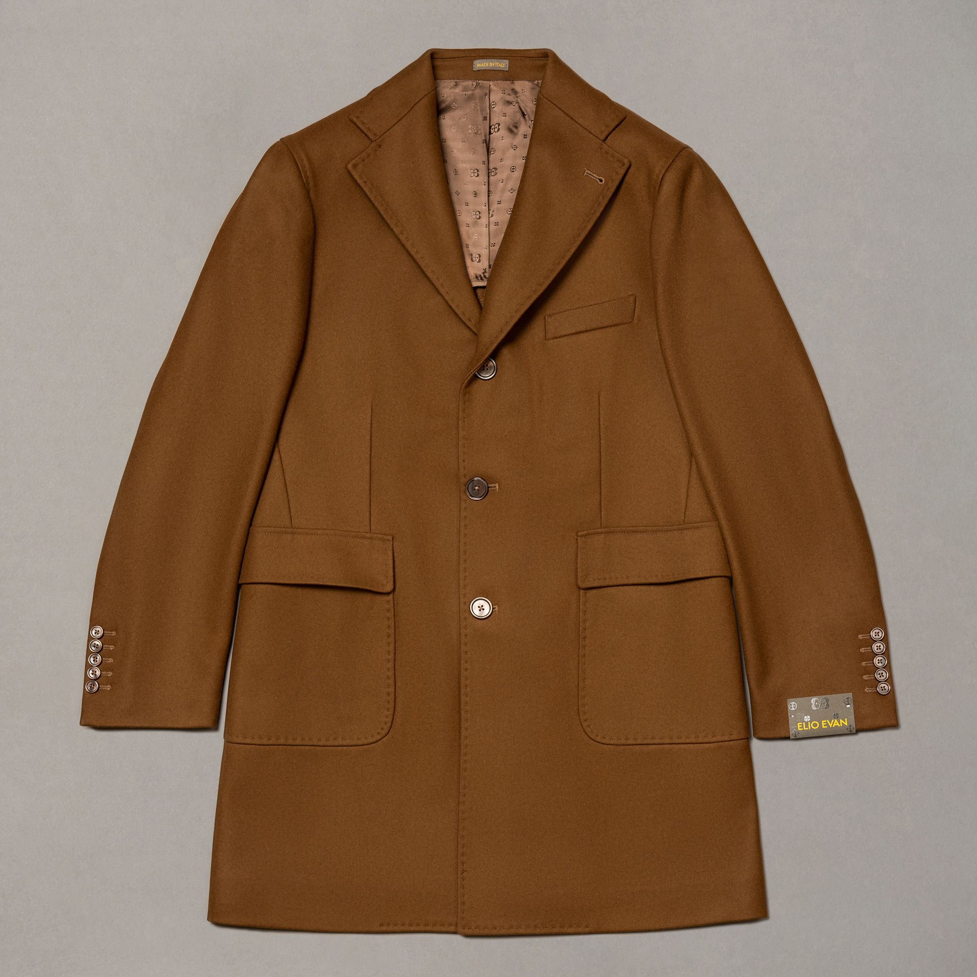 Brown wool-blend coat by Elio Evan — single-breasted front and natural shoulder