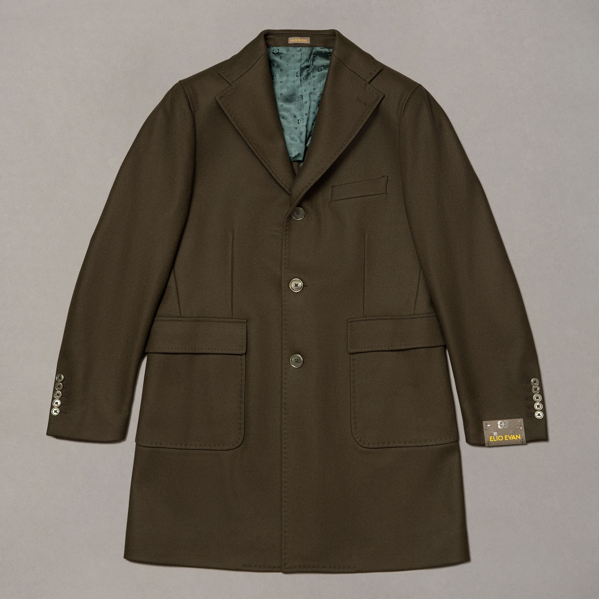 Green wool-nylon coat by Elio Evan — single-breasted front and natural shoulder