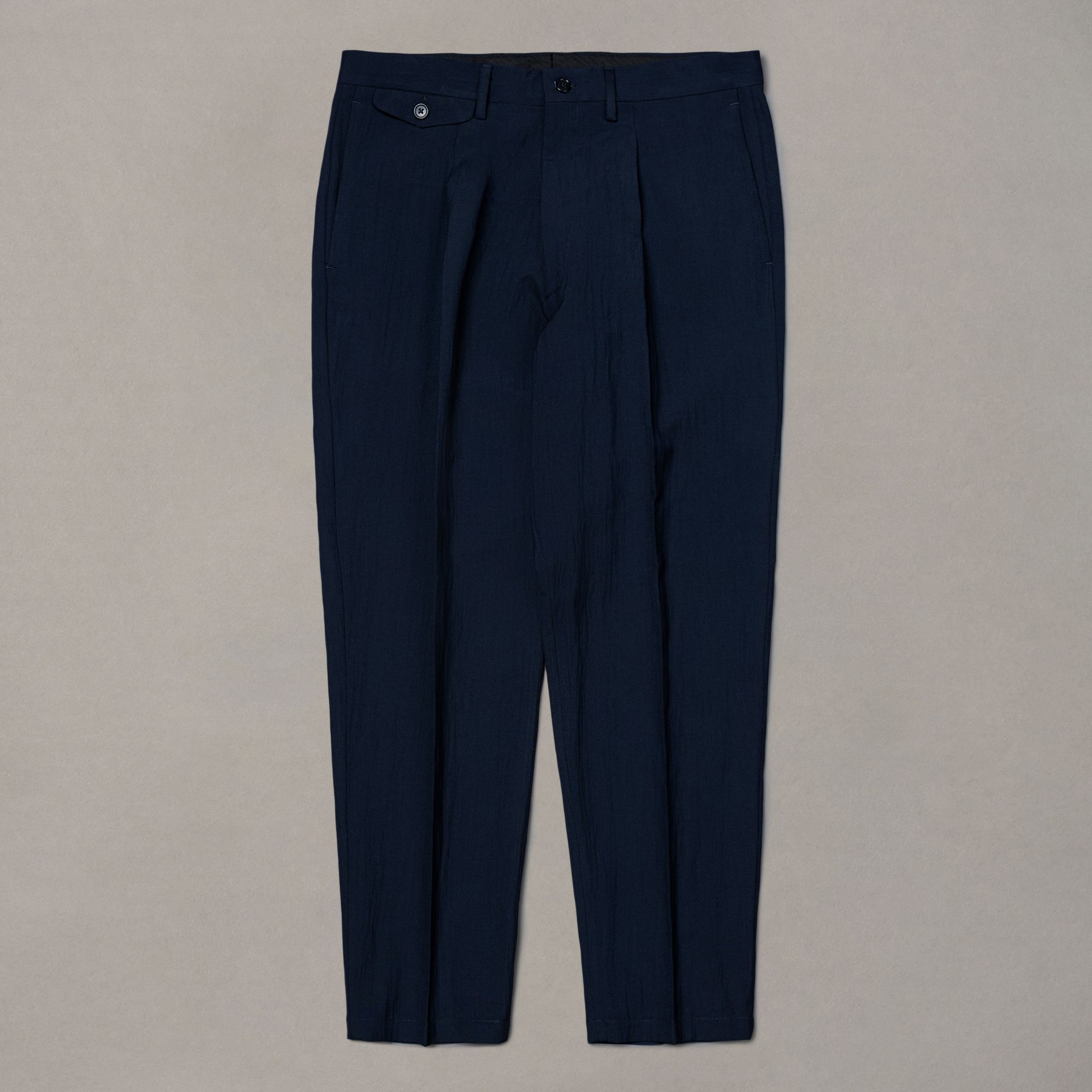 Blue wool trousers from Elio Evan — relaxed silhouette with a clean solid finish