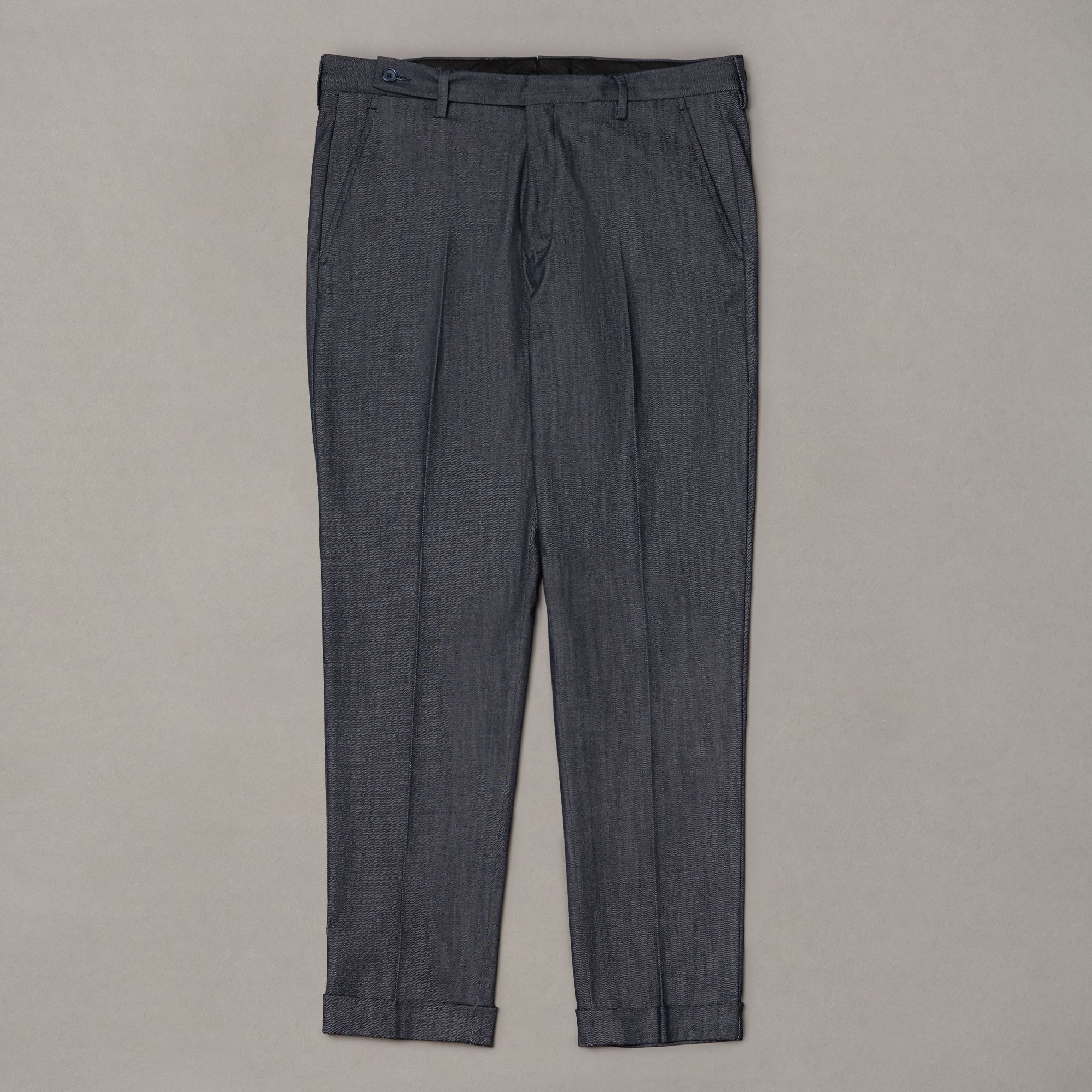 Blue trousers in a Japanese stretch fabric blend of lyocell, polyester, cotton and elastane. Smooth in handle with a cle