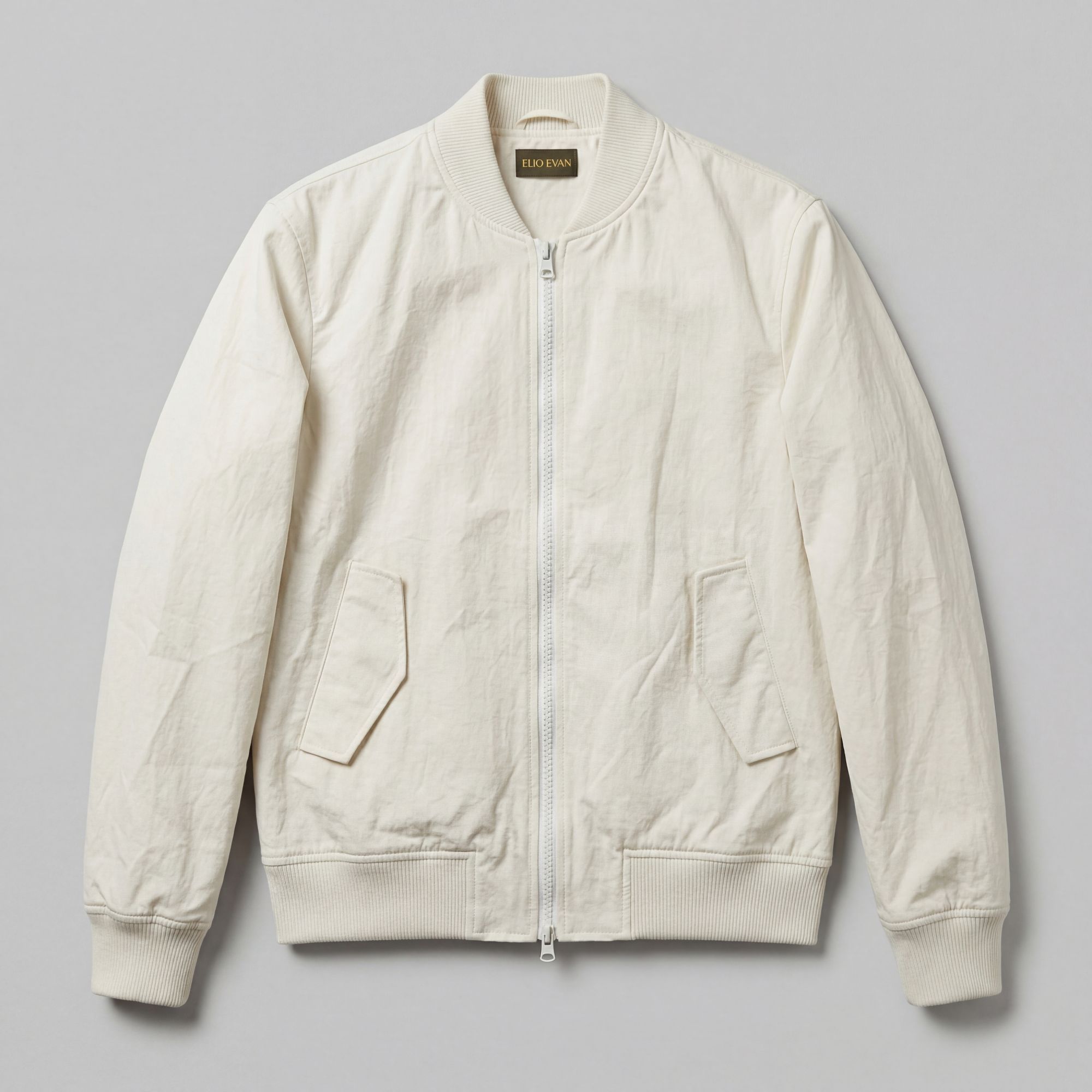 Lightweight white nylon jacket with zip fastening and patch pockets. Structured premium menswear with Italian craft by E