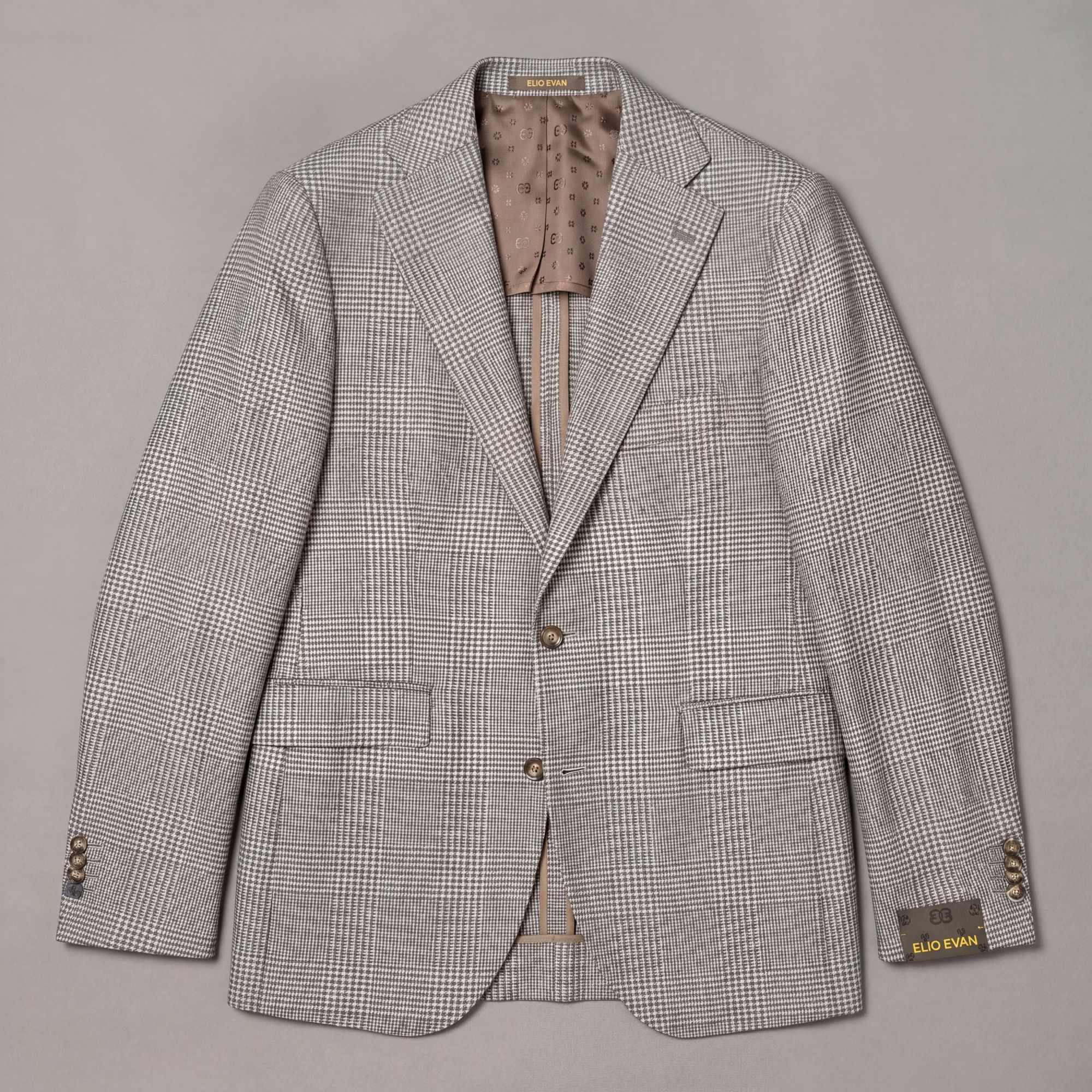 Beige jacket in stretch wool with a herringbone check. The cloth has a brushed hand-feel, light sheen, and enough give f