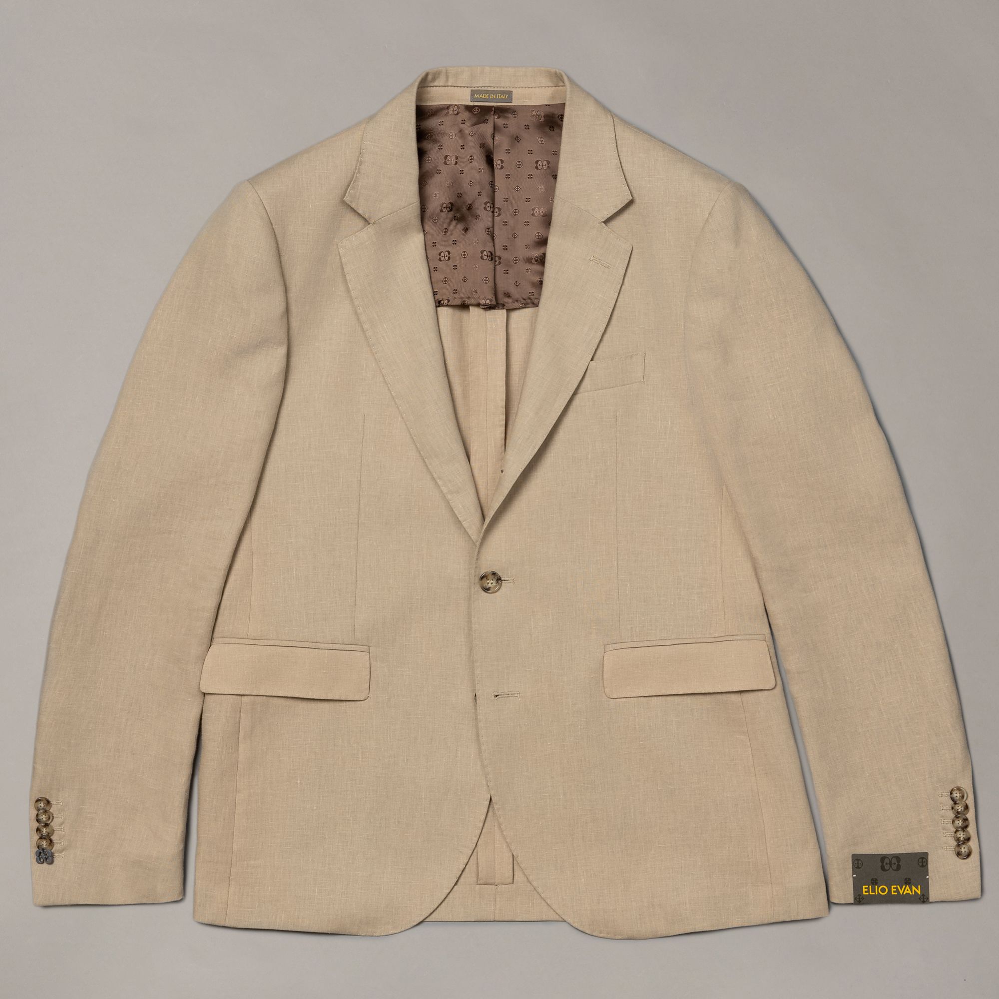 Beige linen jacket from Elio Evan — solid colour with relaxed tailored silhouette