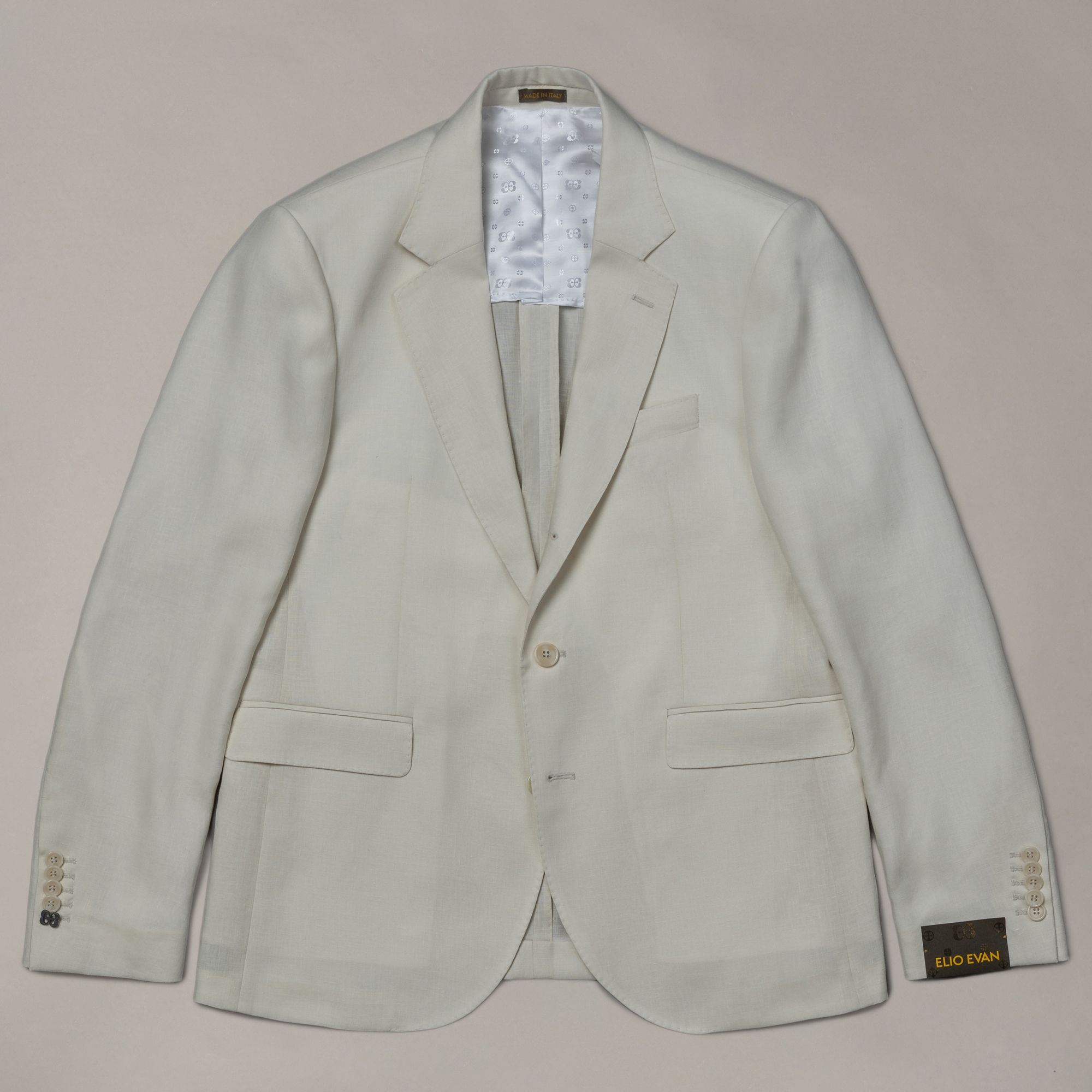 White linen jacket from Elio Evan — solid relaxed tailored silhouette