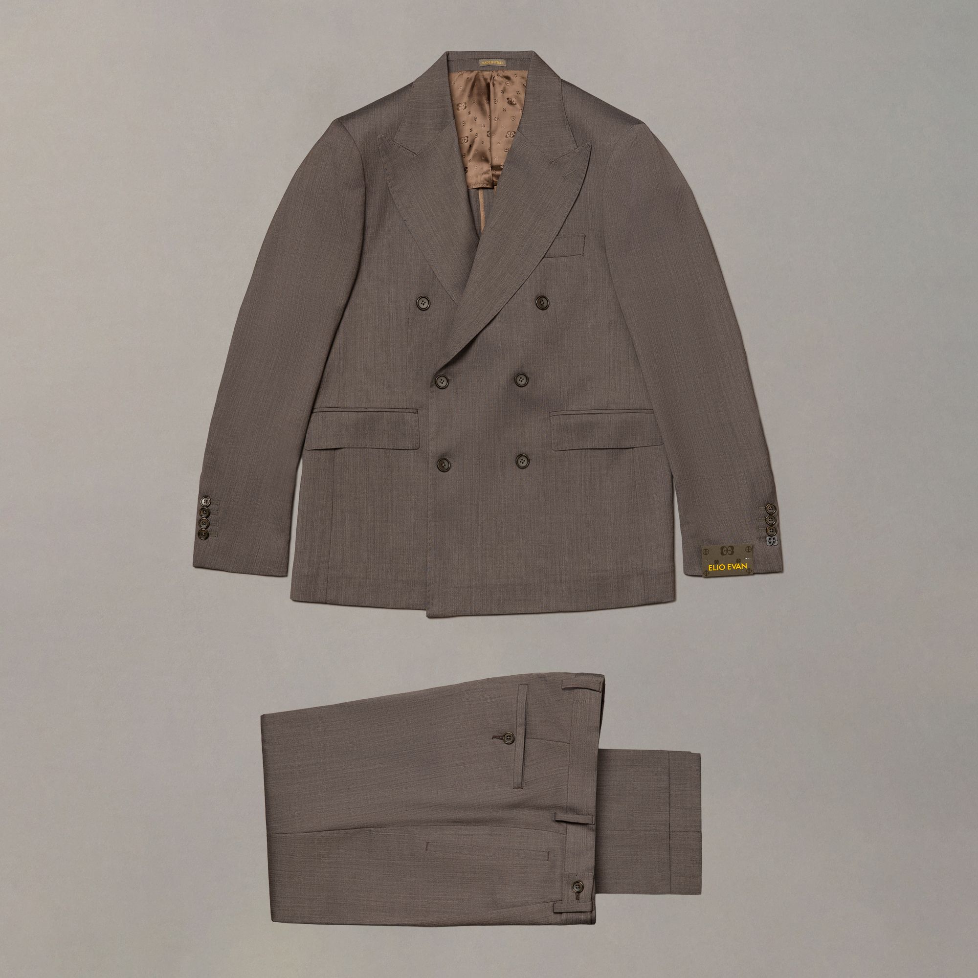 Brown wool suit by Elio Evan — double-breasted front and tailored silhouette