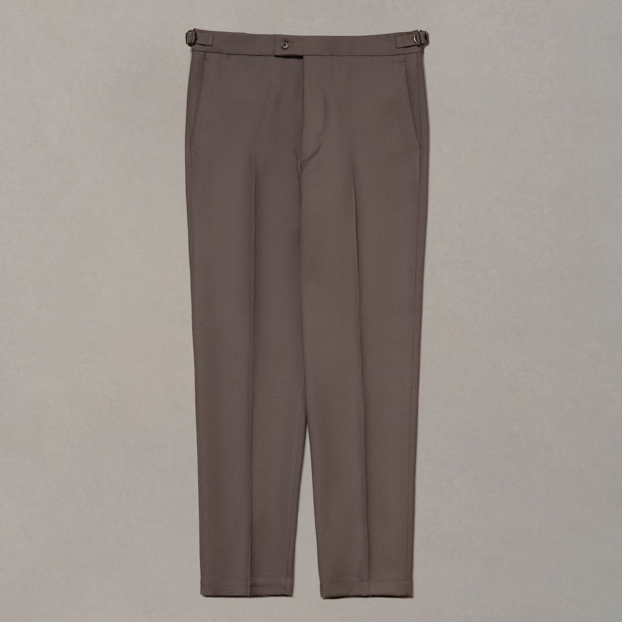 Brown wool trousers by Elio Evan — plain fabric with a clean, uninterrupted leg line