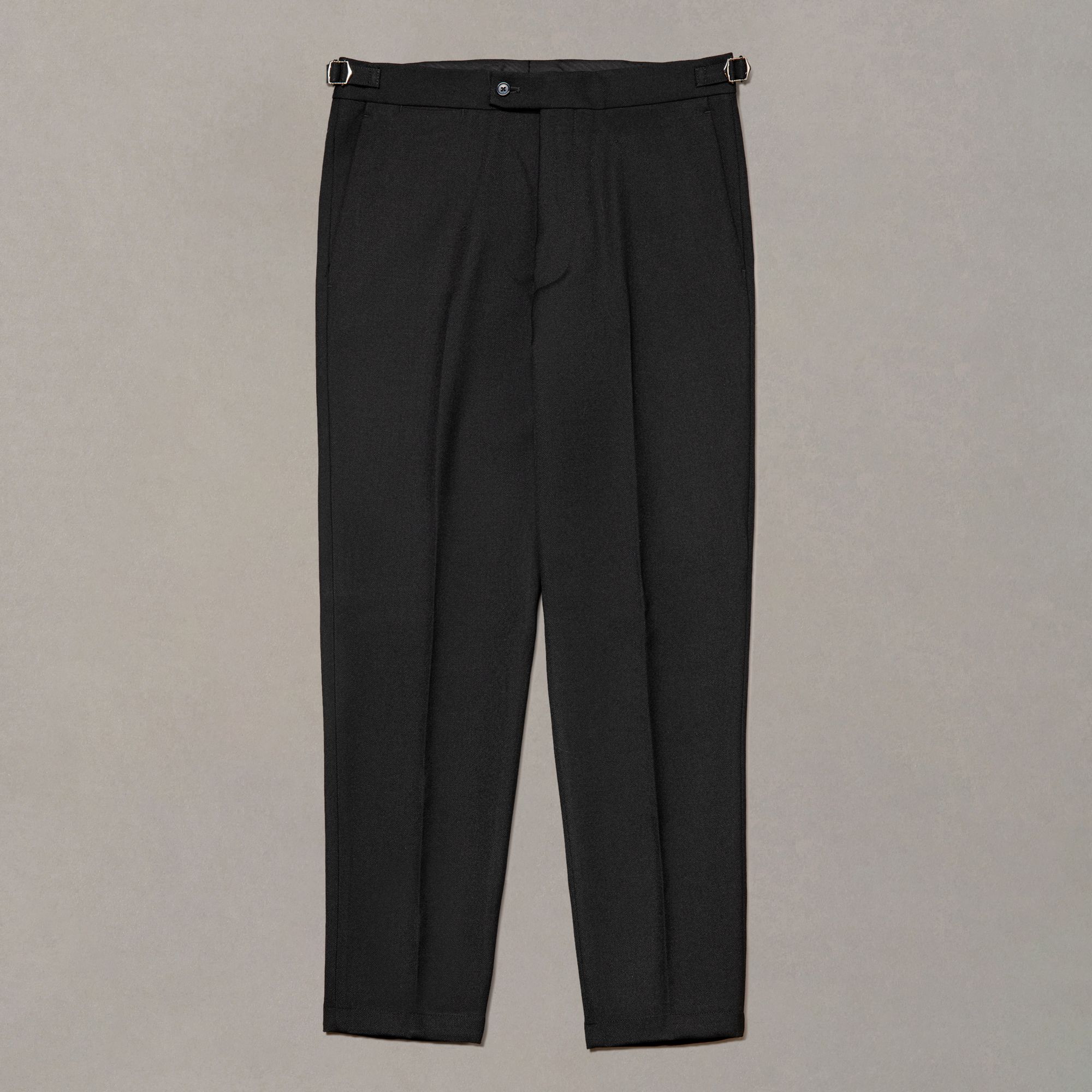 Black wool trousers by Elio Evan — clean lines with a straight fall through the leg