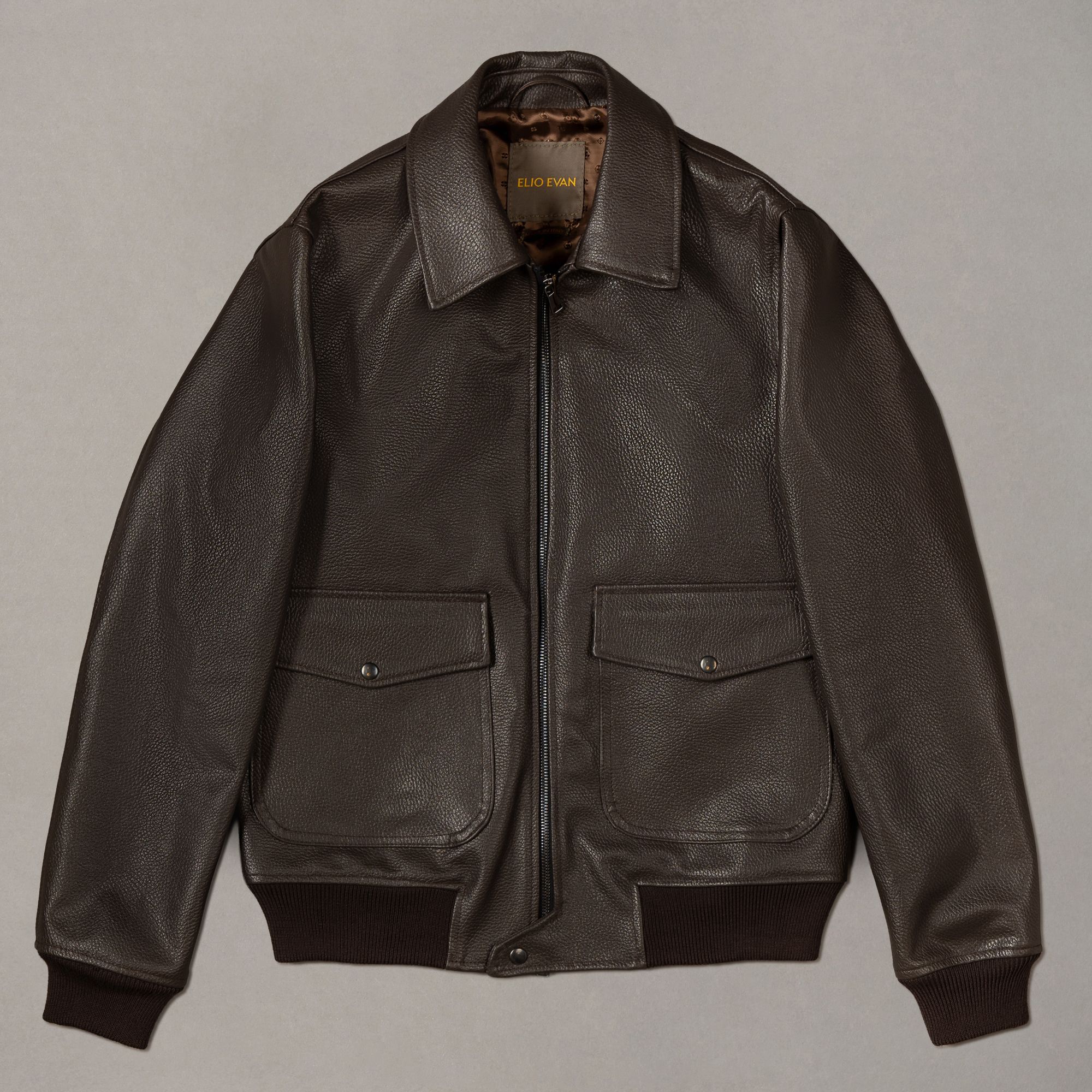 Brown genuine leather bomber jacket by Elio Evan — structured silhouette with a natural shoulder