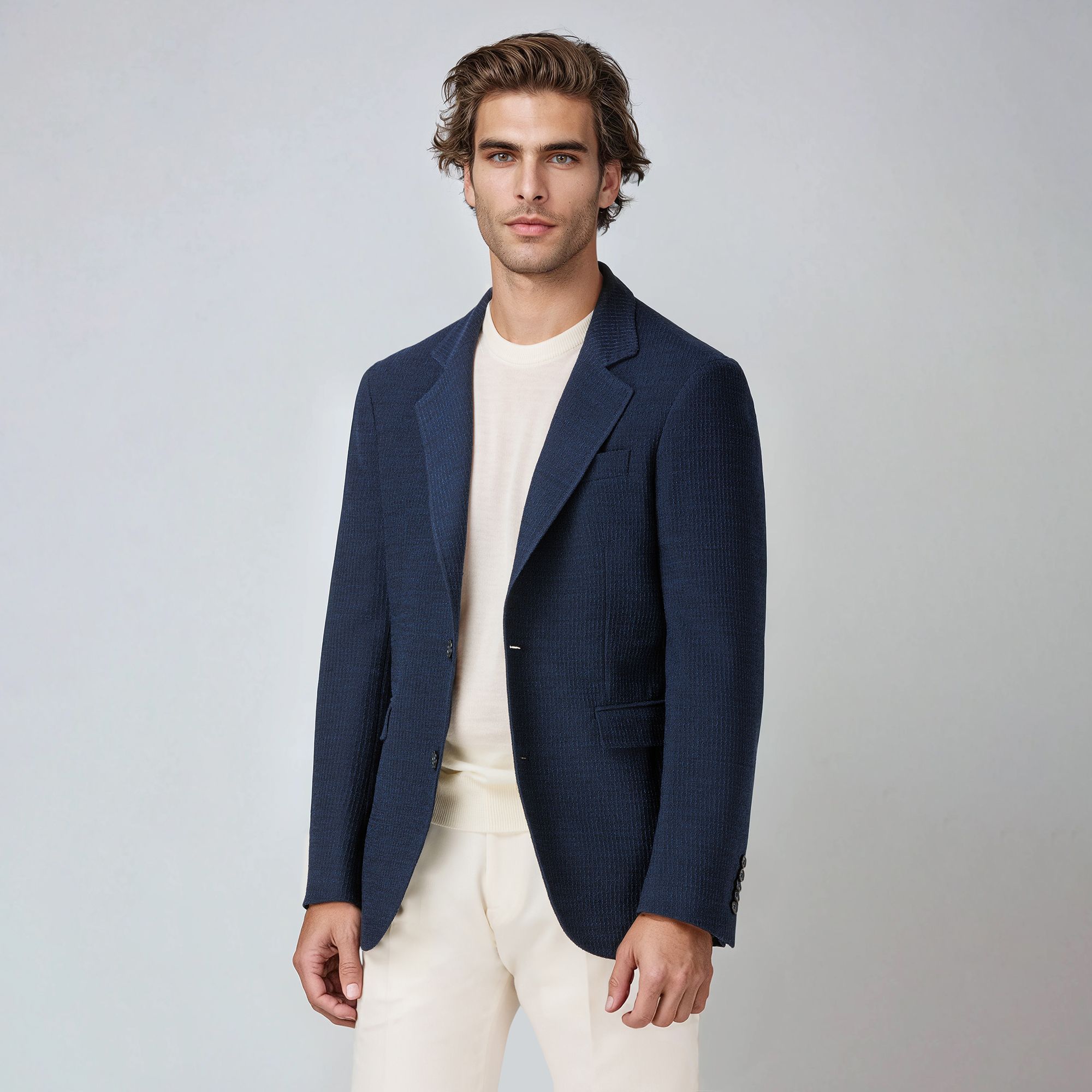 Men’s royal blue wool blazer in Miami model by Elio Evan, with breathable 3D crochet structure, natural shoulder, and relaxed fit. Made in Italy.