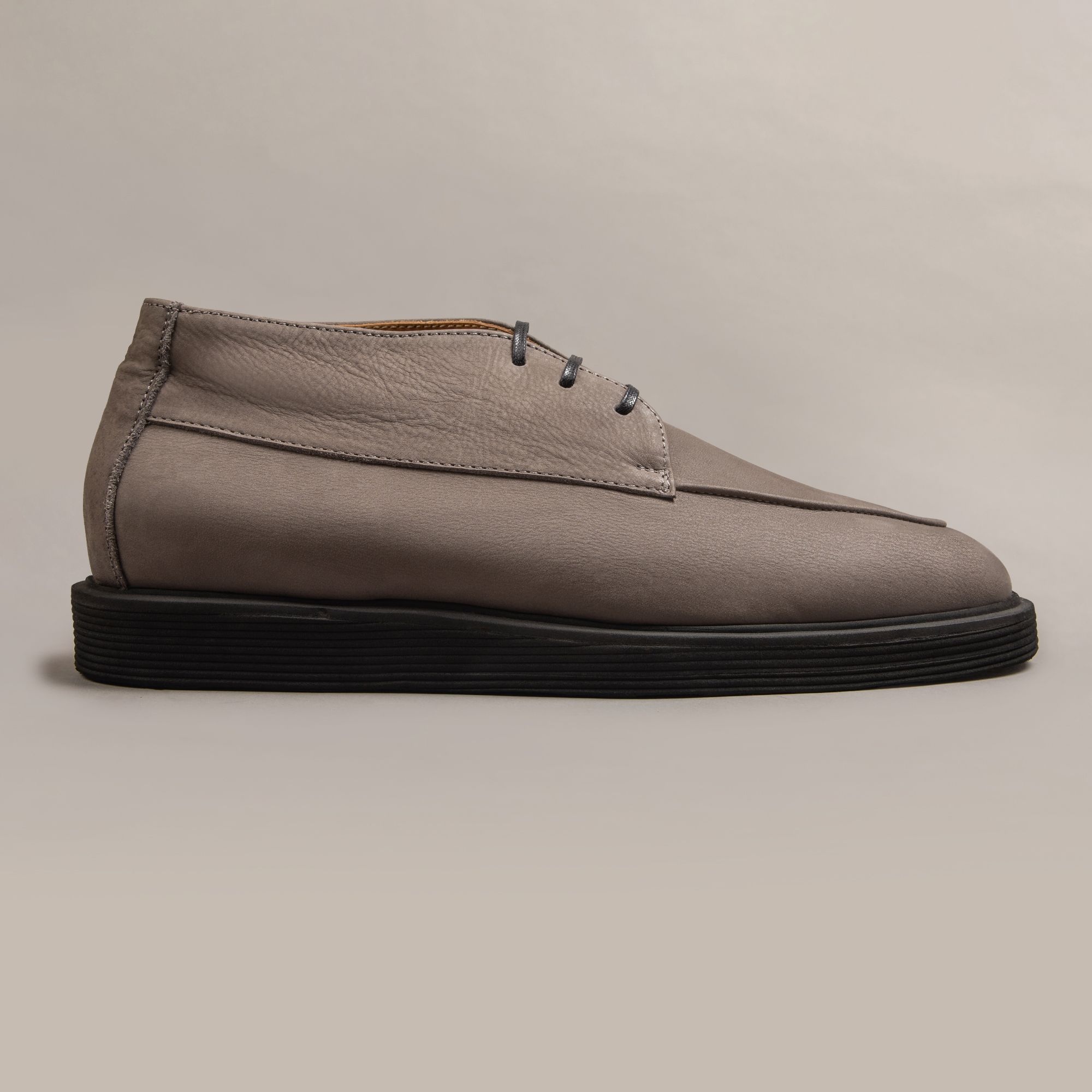 Greige leather boots by Elio Evan — two-eyelet upper with a rubber sole