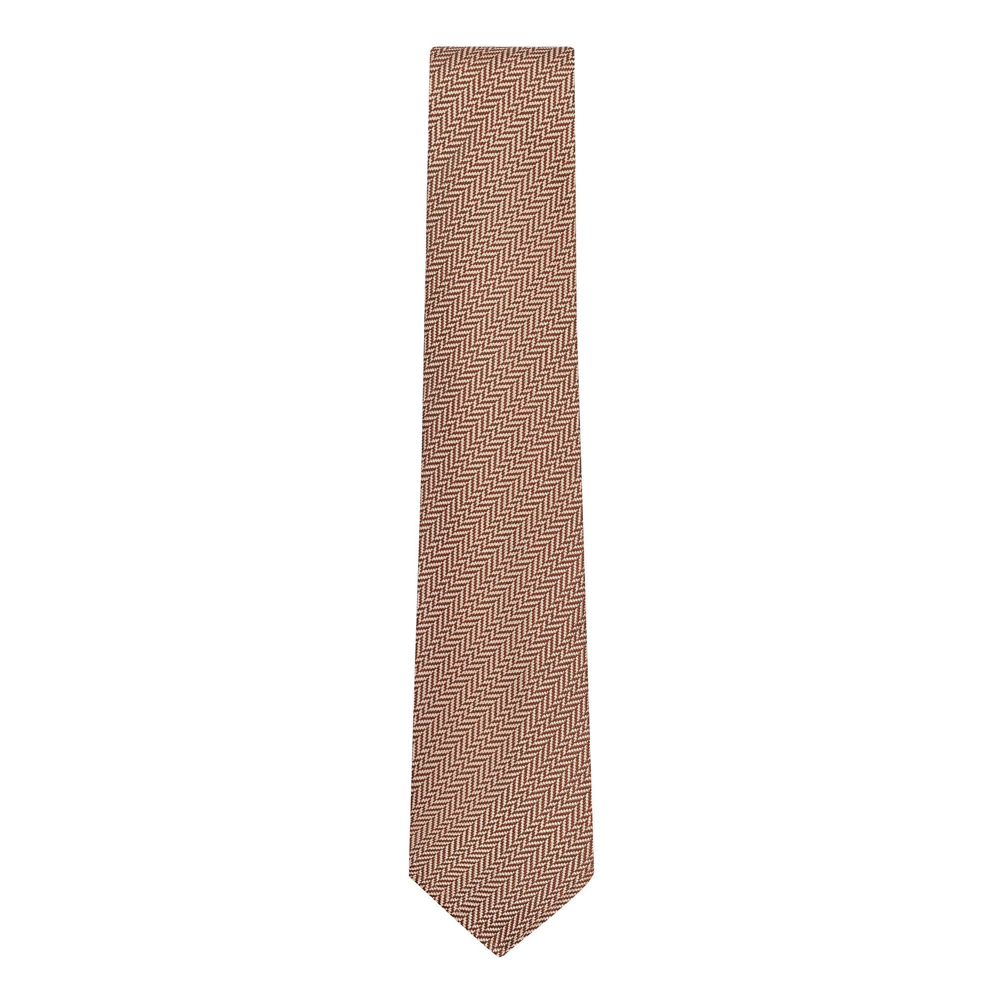 Handmade brown herringbone silk and wool tie by Elio Evan, featuring a classic pattern and luxurious texture.