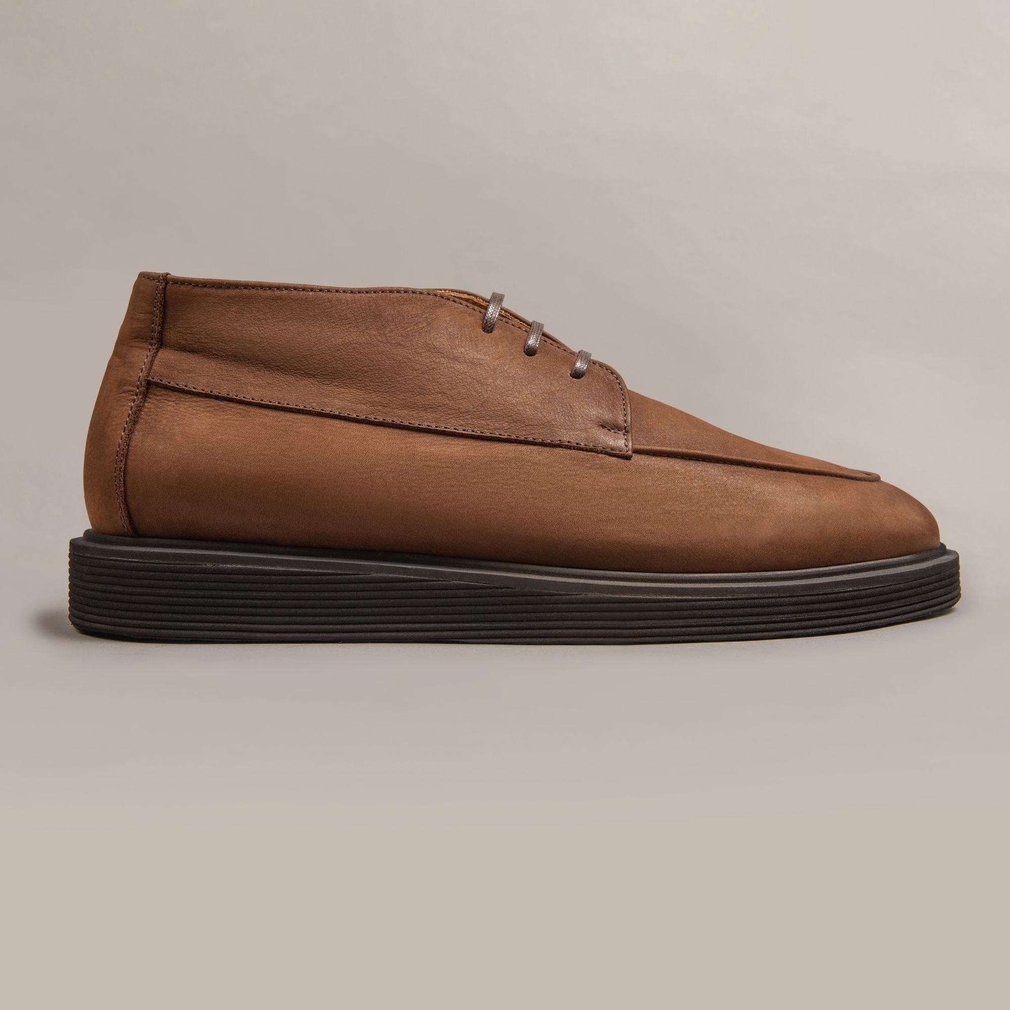 Brown leather boots by Elio Evan — two-eyelet upper and rubber sole