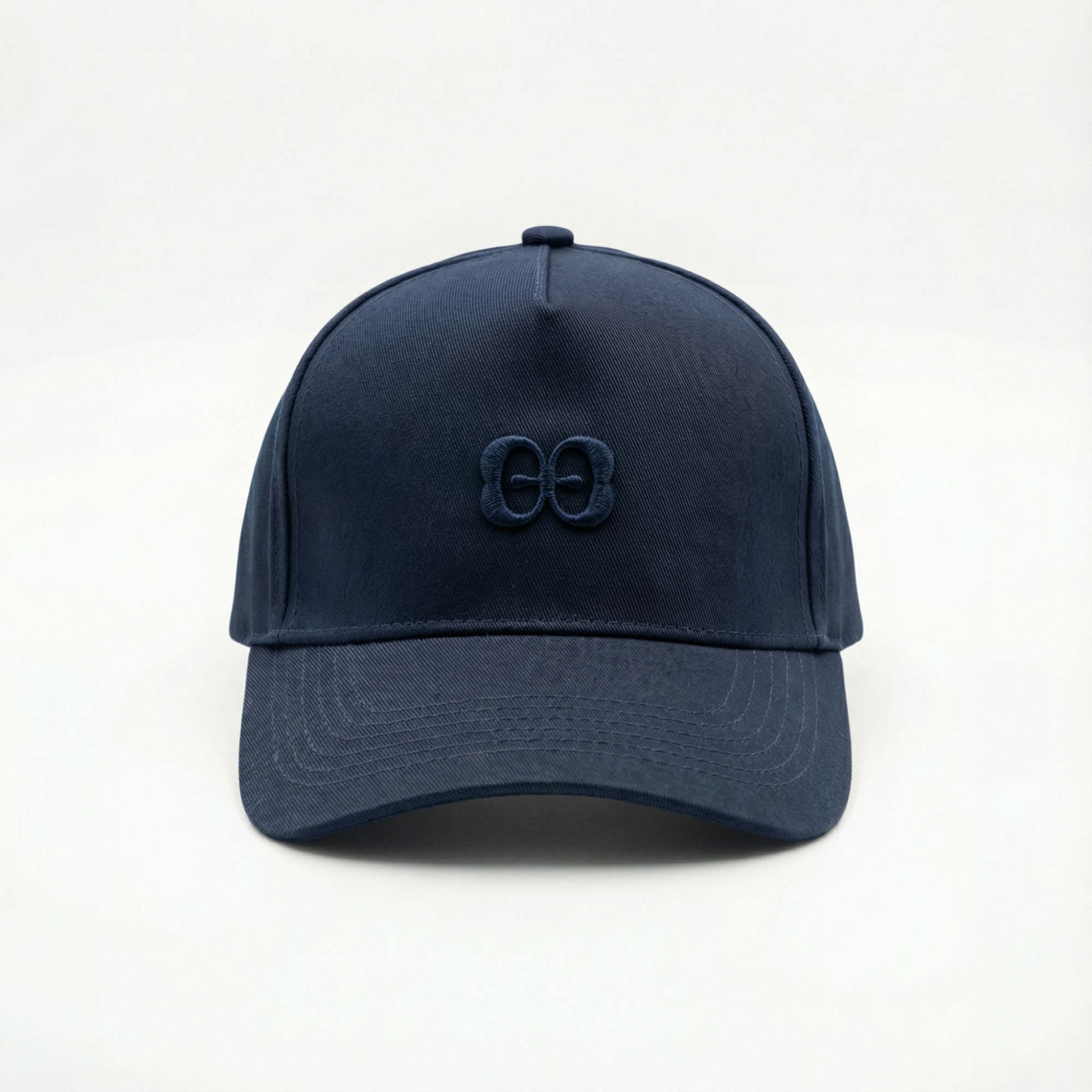 Men’s cotton baseball cap by Elio Evan in navy blue with embroidered 2E logo and adjustable back strap