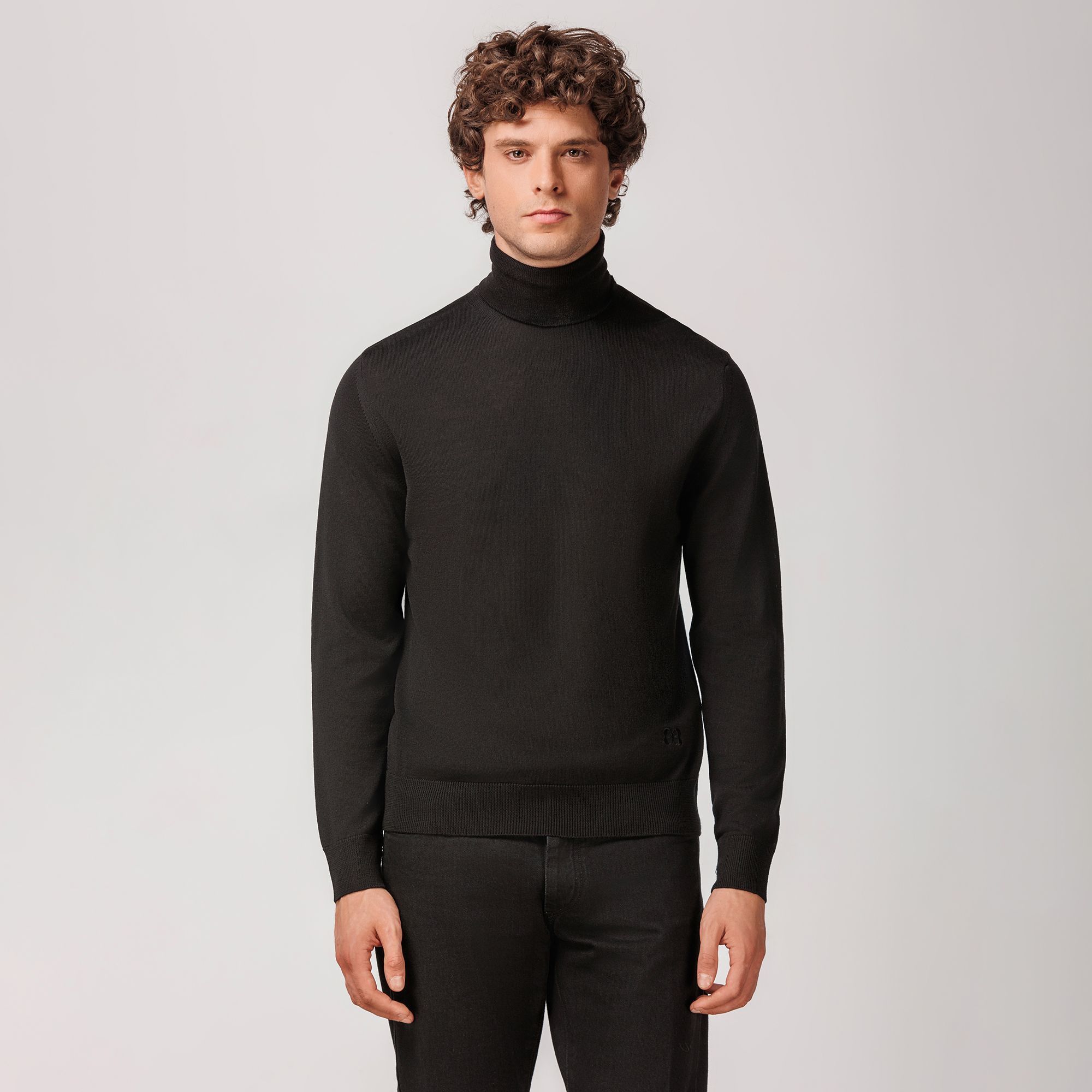 Black rollneck sweater by Elio Evan, crafted from extrafine merino wool with ribbed hems and flawless fit.