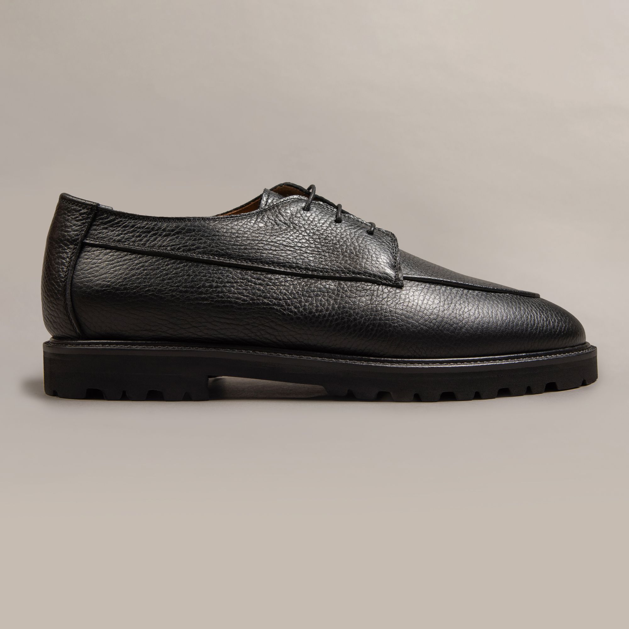 Black leather derbies by Elio Evan — two-eyelet upper and rubber sole