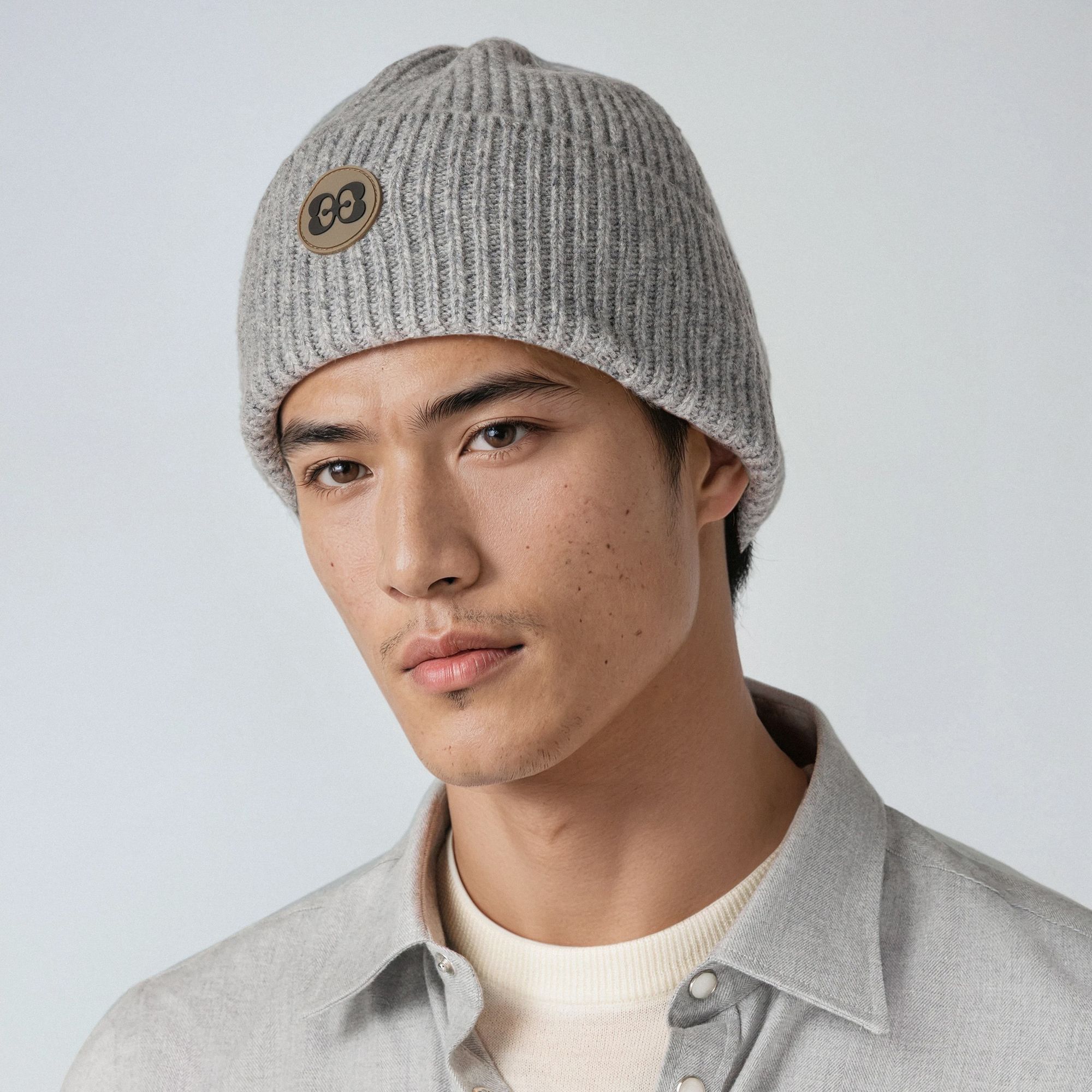 Elio Evan beanie in 100% virgin wool, designed in ribbed knit with the signature Elio Evan 2E emblem