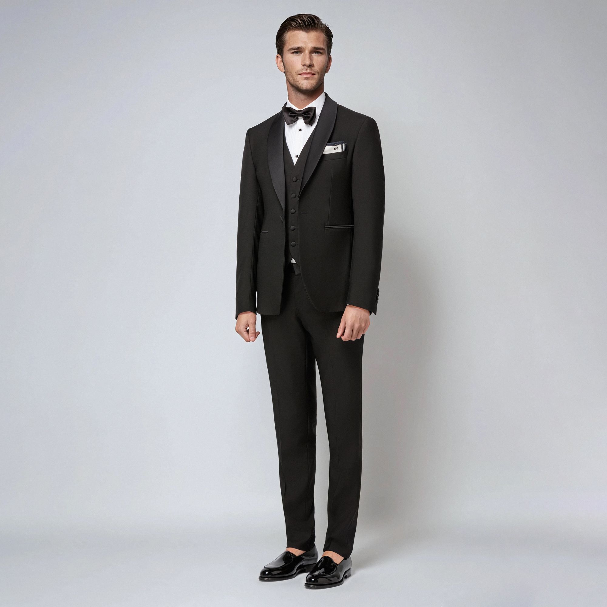 Men’s total look with black three-piece tuxedo and bow tie by Elio Evan
