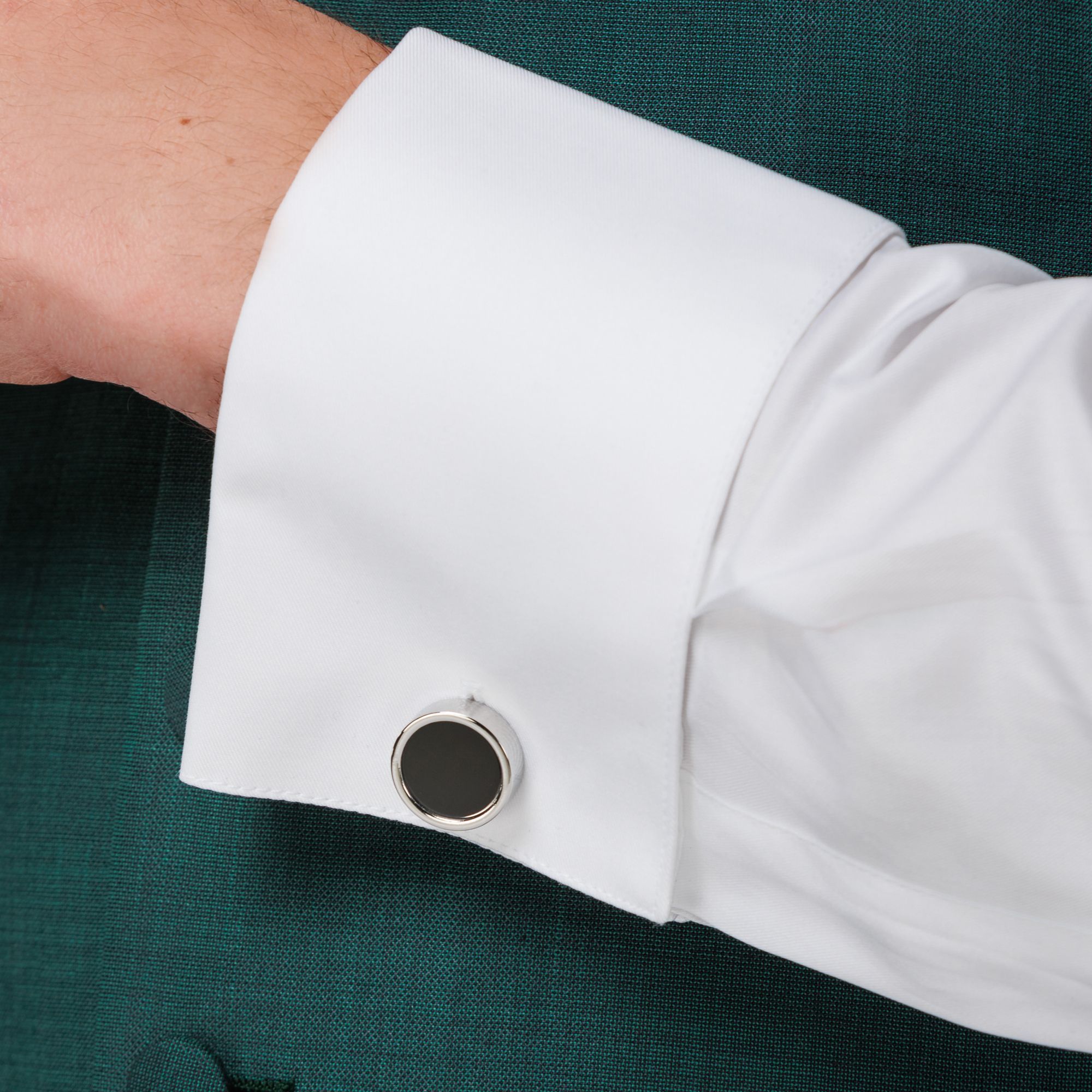 Elio Evan round silver cufflinks with black enamel center and fixed closure.